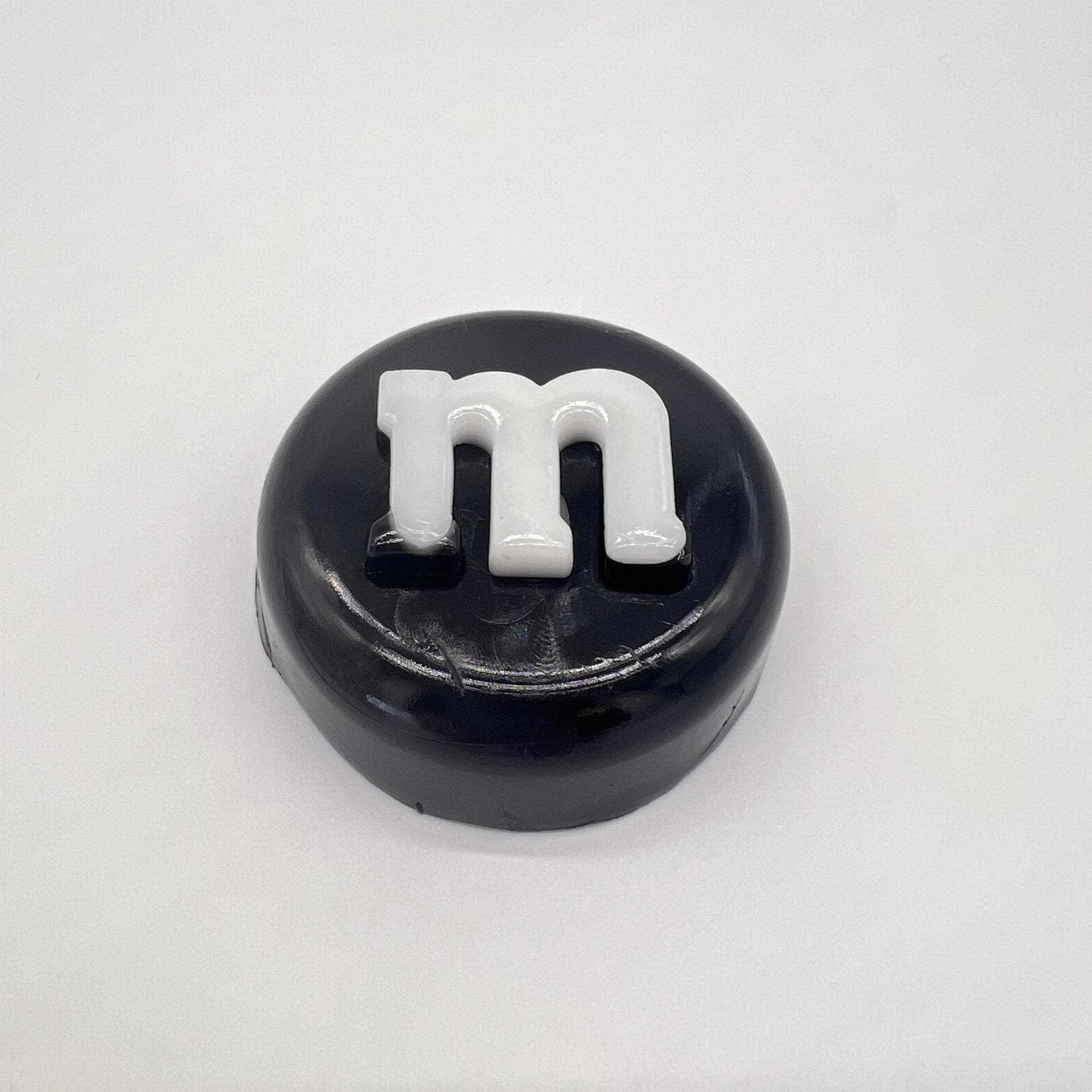 Іграшка антистрес Сквіш Таба Лапка M&M's чорна 7 см (2006253)